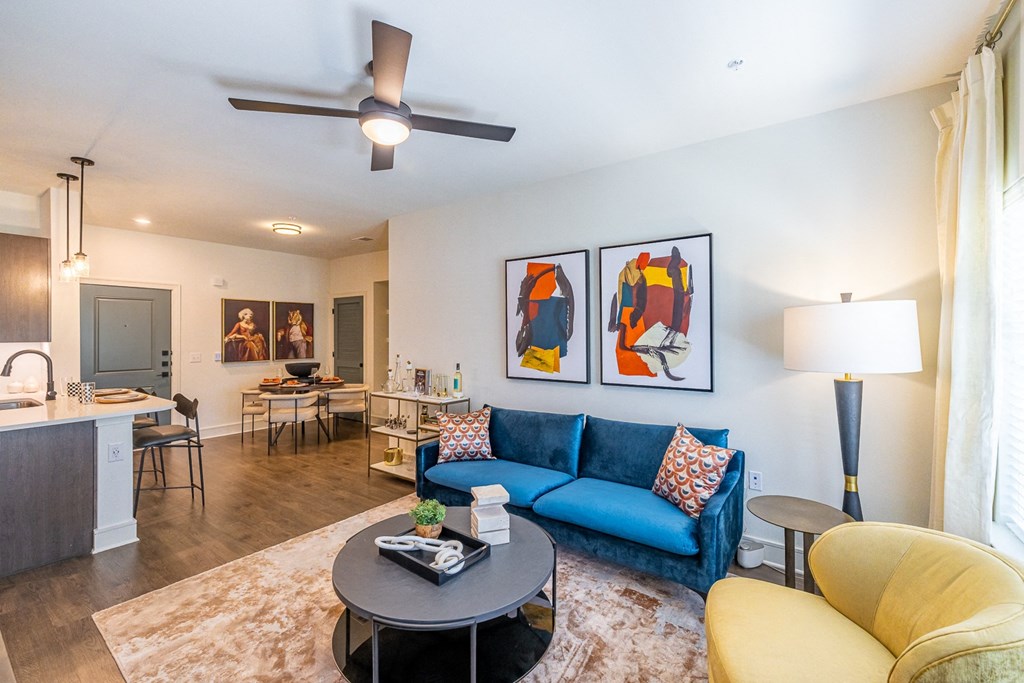 a living room with a blue couch and a coffee table