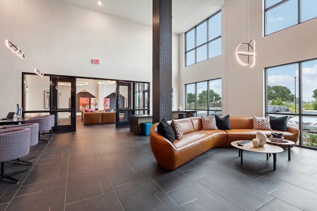 a lobby with a couch and a table