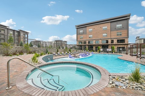A round pool with a metal railing around it.
