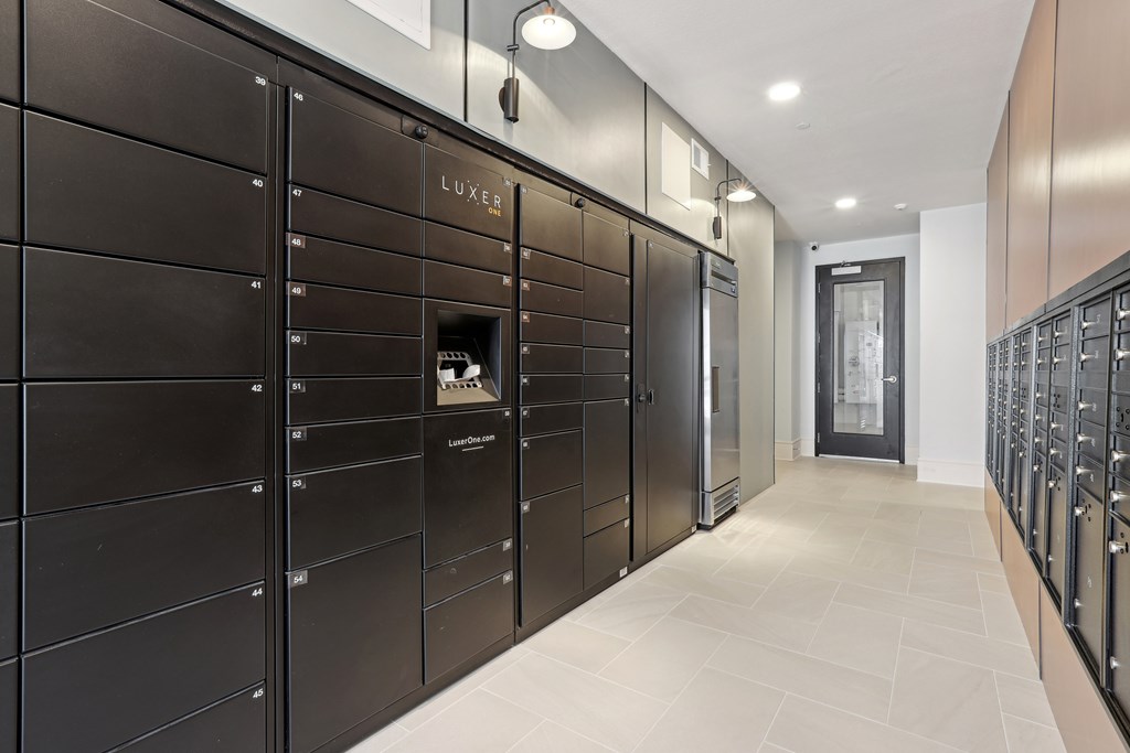 A row of black lockers with a sign that says "LUXE".
