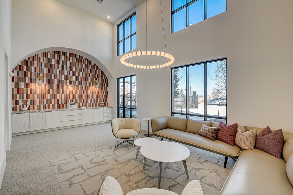 a living room with a couch and tables
