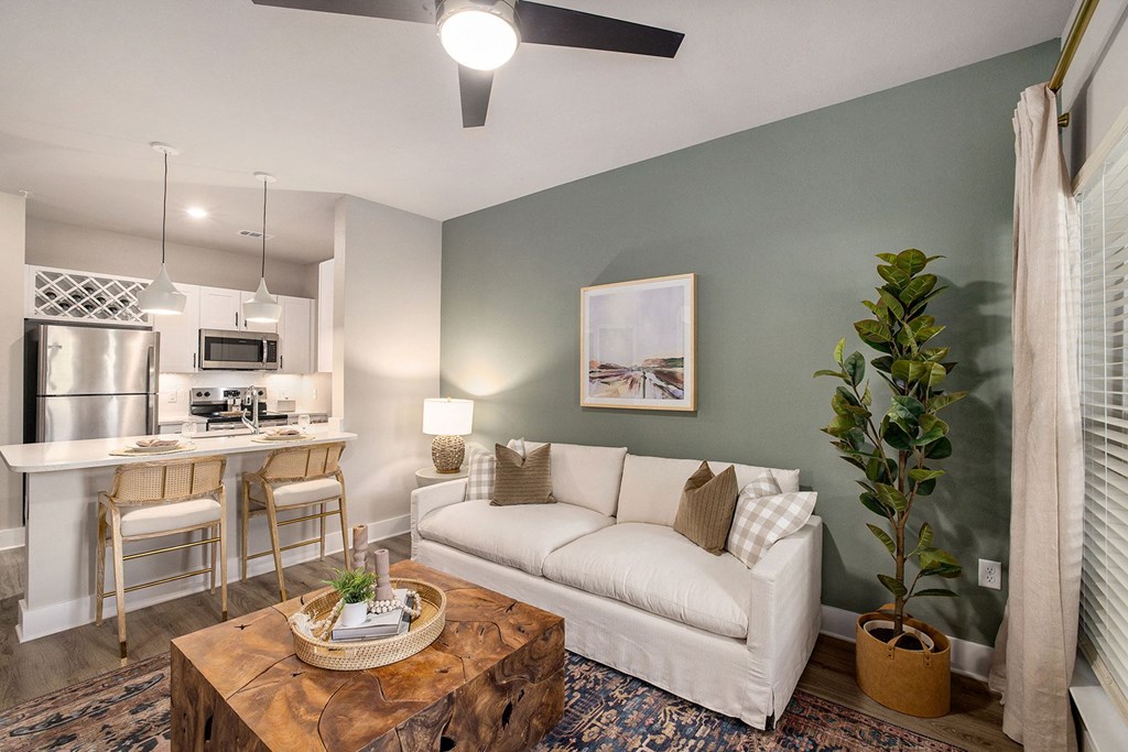 an open living room and kitchen with a couch and a table