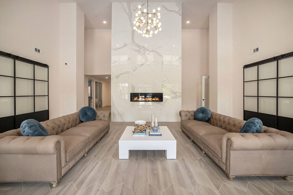 a living room with two couches and a white coffee table