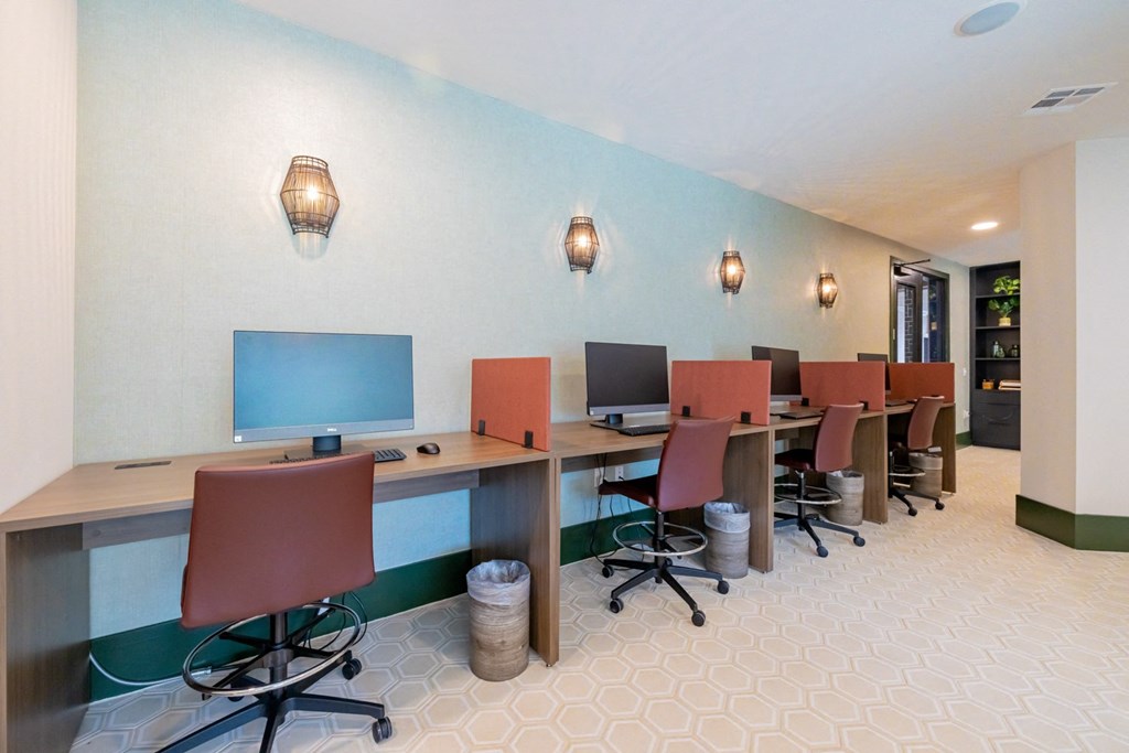 a conference room with computers and chairs at the residence carrier circle
