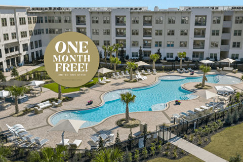 A pool surrounded by chairs and umbrellas with a sign that says "One Month Free!"