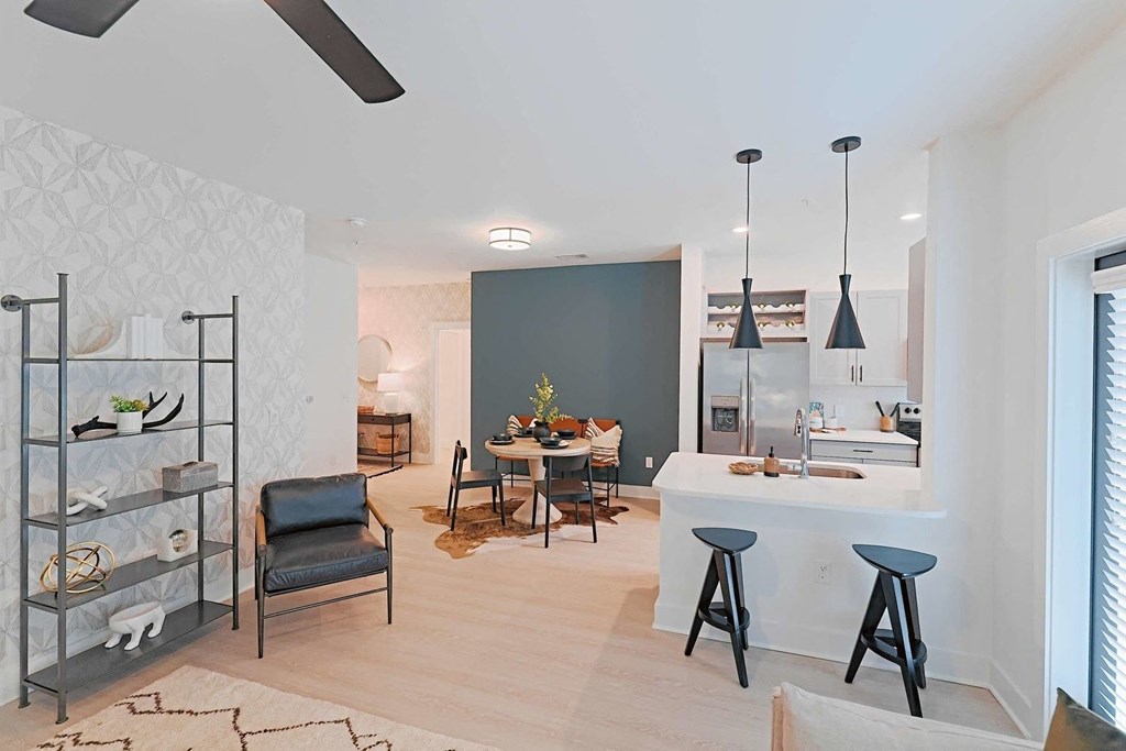 a living room with a kitchen and a dining room