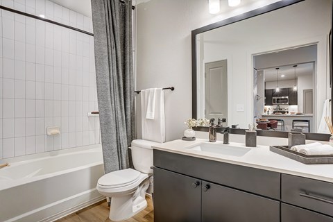 Bathroom with Quartz Countertop and Soaking Tub