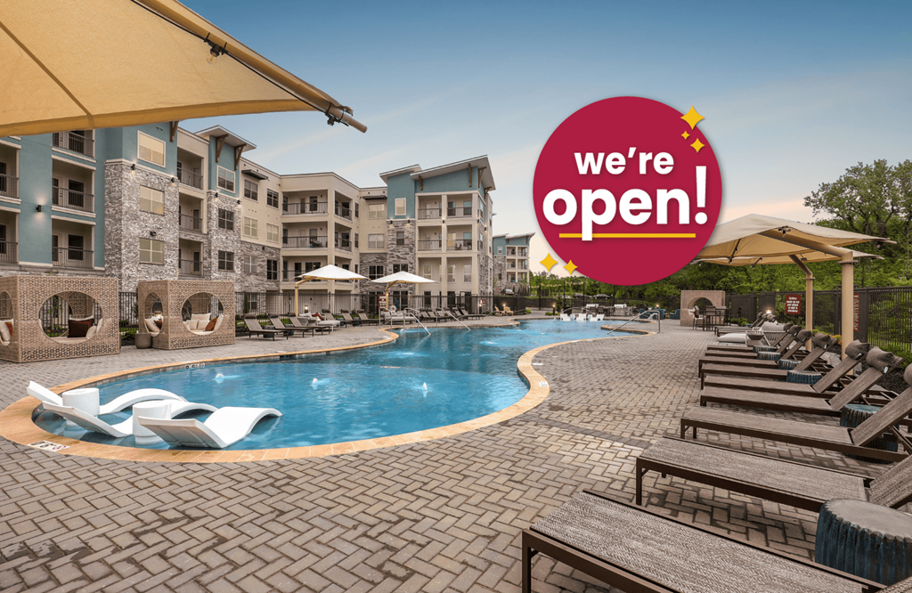an image of a pool with a sign that says were open at a resort