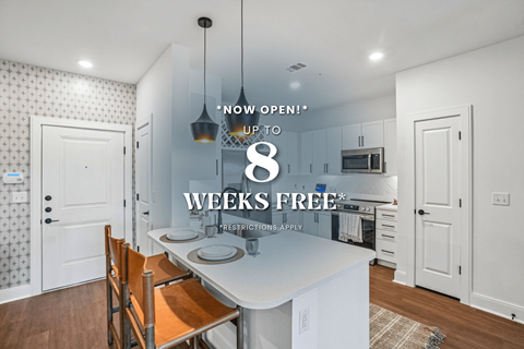 A kitchen with a sign that says "Now Open! Up to 8 Weeks Free".