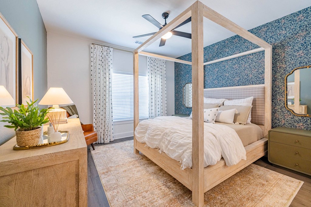 a bedroom with a bed and a dresser and a window