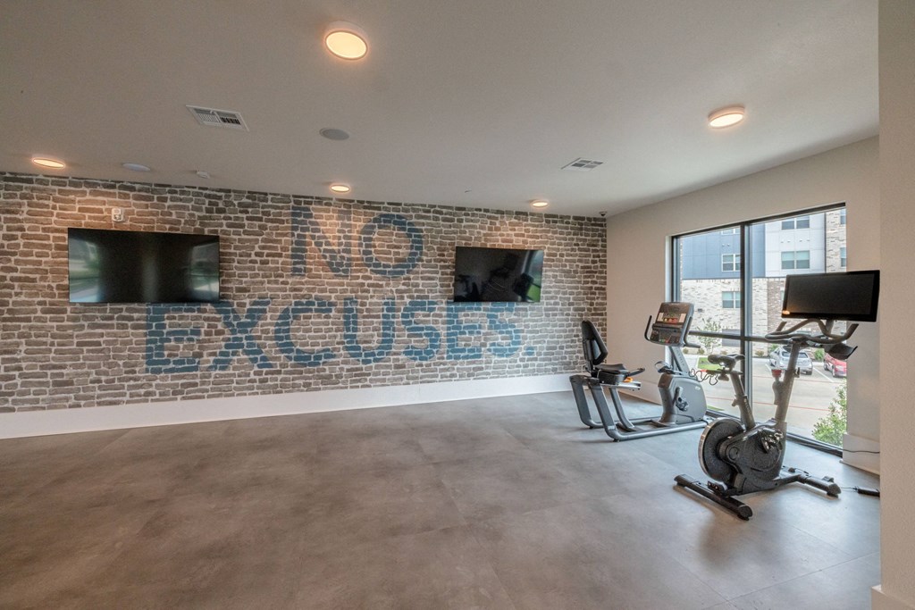 the gym at the district flats apartments in lenexa