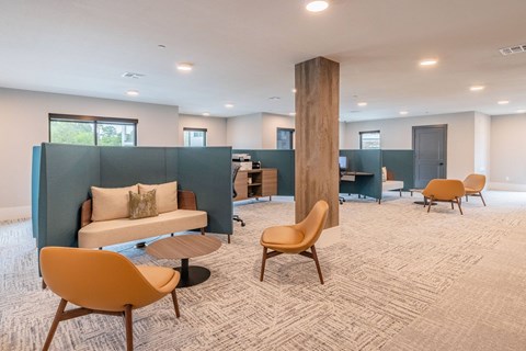 A room with a blue partition and a brown chair.