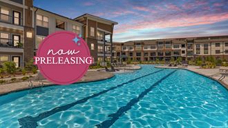 a swimming pool with an apartment building in the background