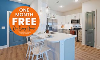a one month free on every third floor home with a white kitchen table and chairs