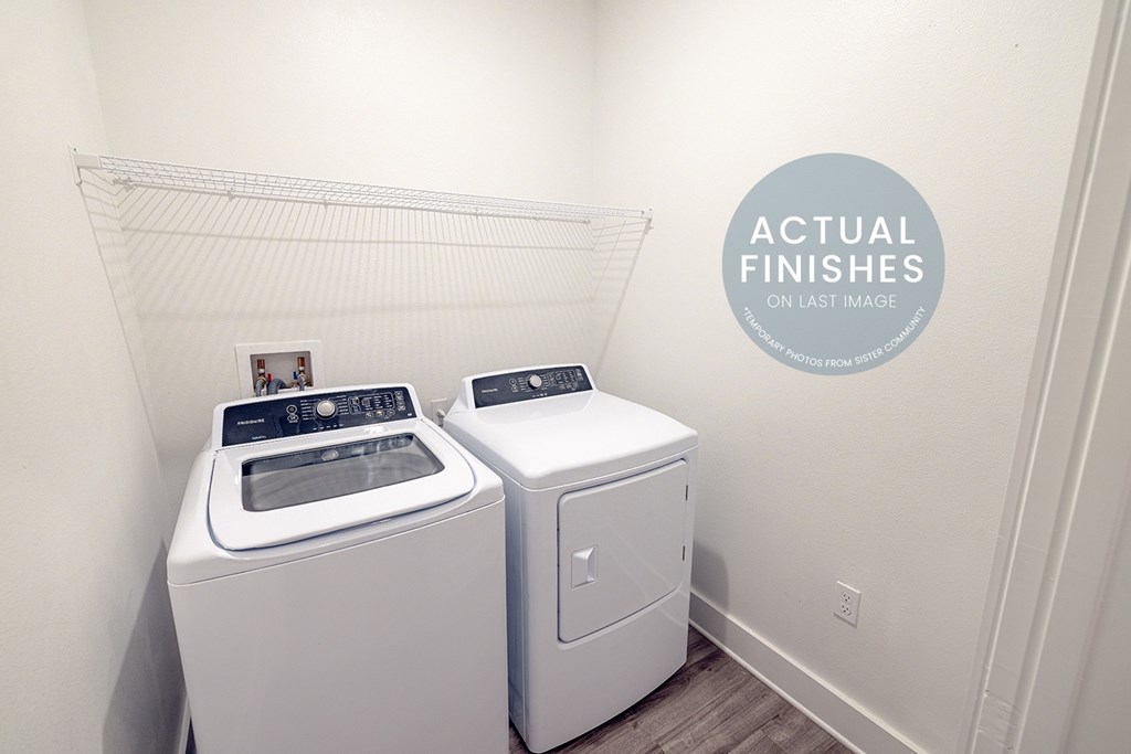 A washer and dryer in a laundry room.