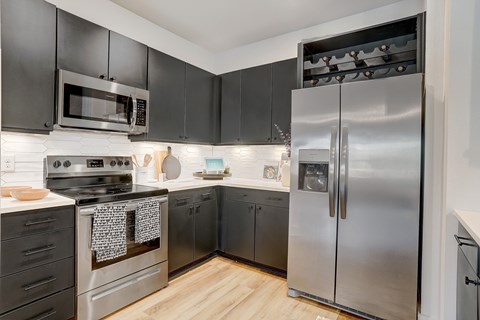 Kitchen with Quartz Countertop and Stainless Steel Appliances.
