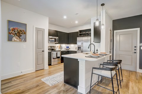Kitchen with Quartz Countertop and Stainless Steel Appliances.