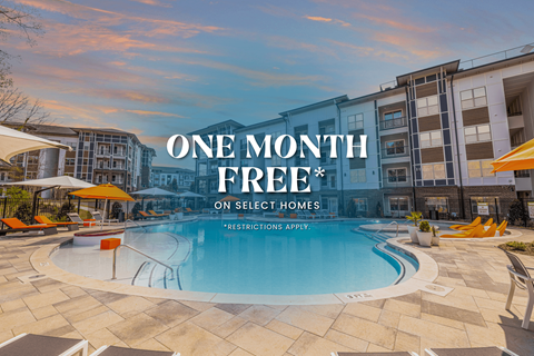 A swimming pool surrounded by lounge chairs and umbrellas with a building in the background and text that reads "ONE MONTH FREE* ON SELECT HOMES *RESTRICTIONS APPLY".