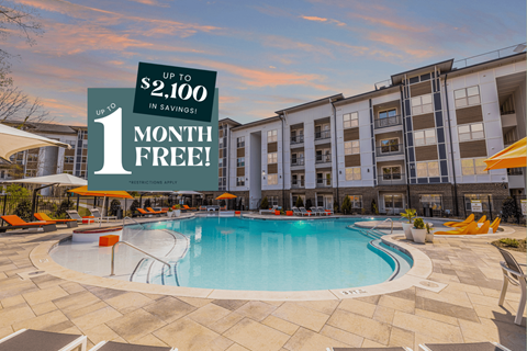 A pool area with a sign offering up to $2,100 in savings for 1 month free.