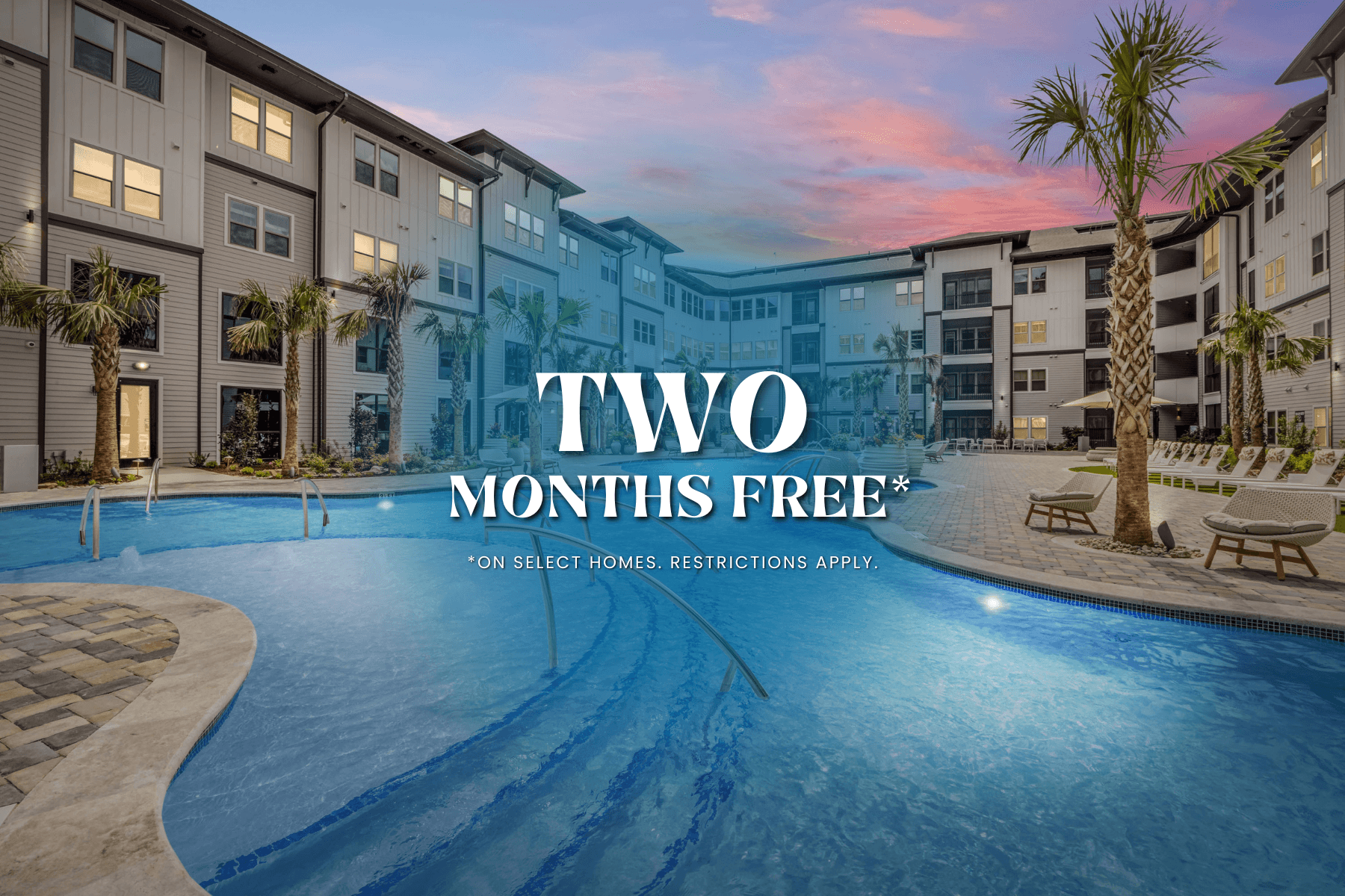 A swimming pool in front of a building with the text "TWO MONTHS FREE" on it.
