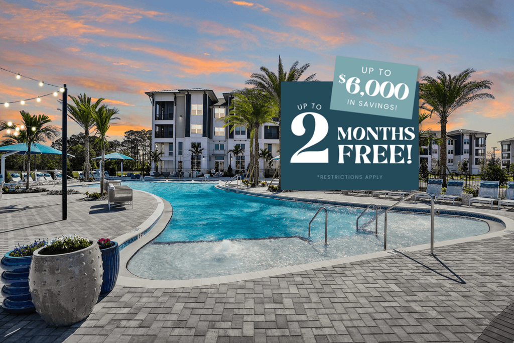 A sign advertises up to $6,000 in savings for 2 months free at a resort.