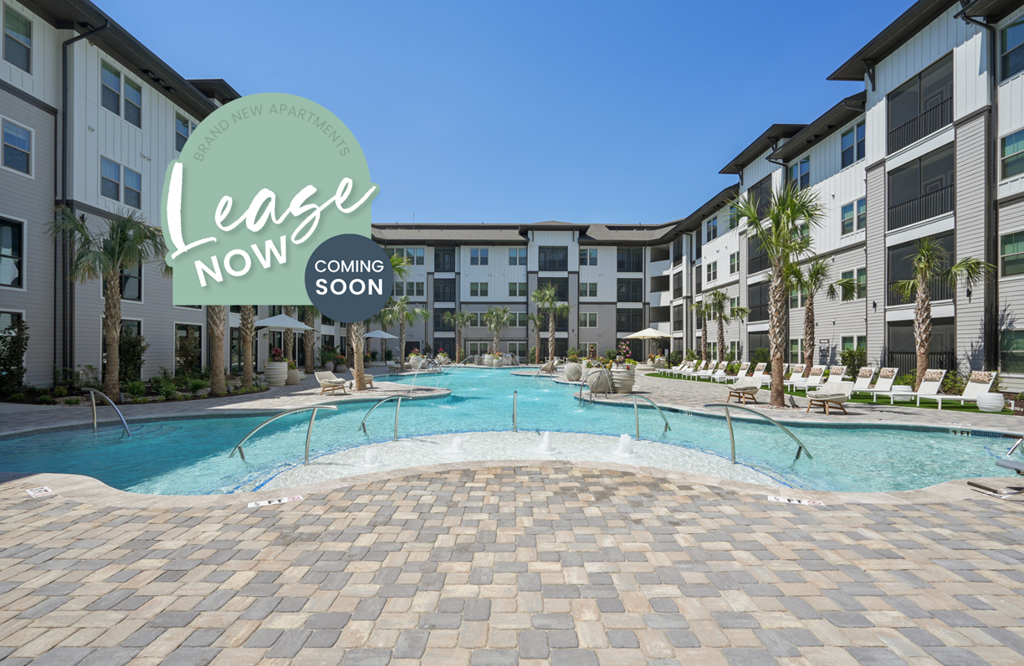 a large swimming pool with an apartment building in the background