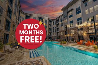 an image of an apartment pool with a sign that says two months free