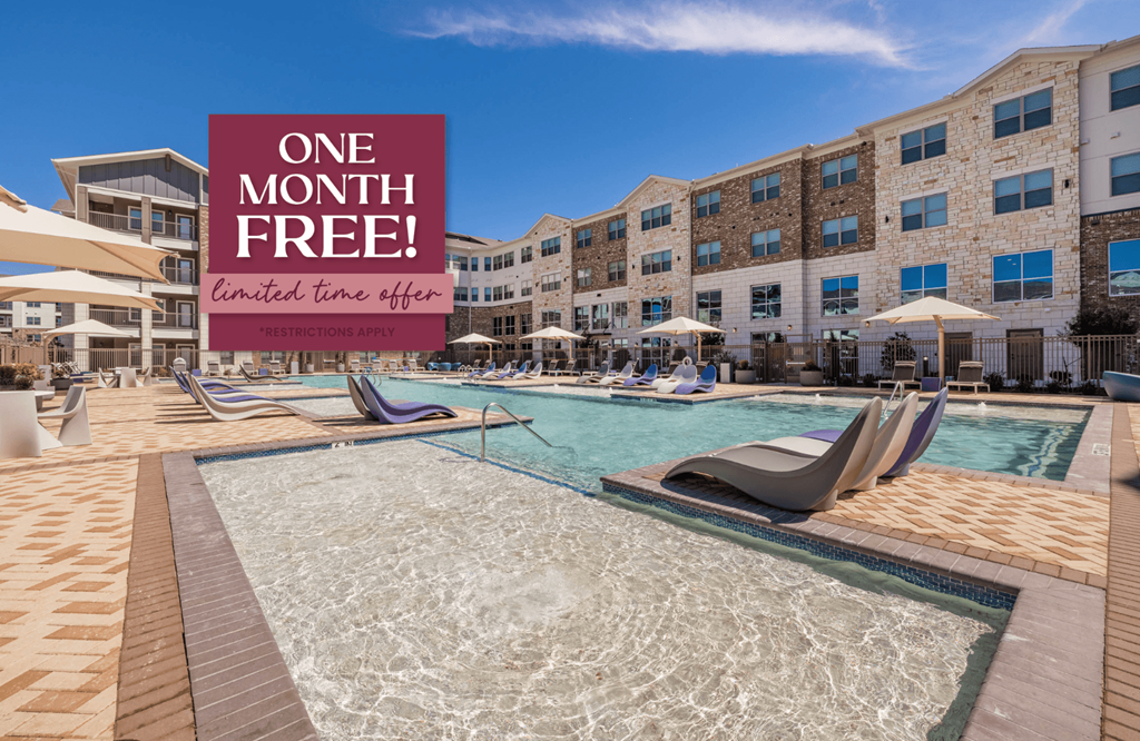 a pool with a sign that reads one month free at an apartment building