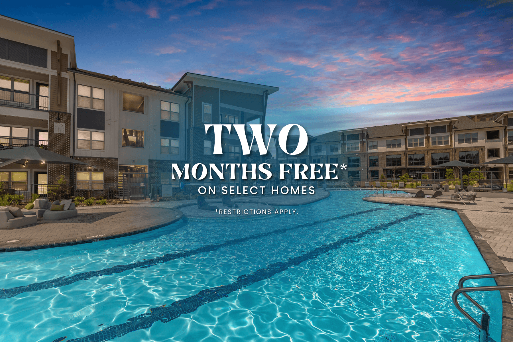 A swimming pool is part of a residential complex offering two months free on select homes.