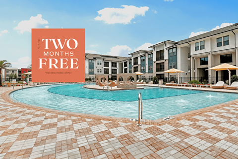 a swimming pool with an advertisement for two months free at an apartment building