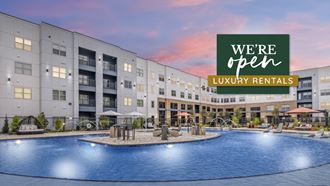 an image of an apartment building with a swimming pool