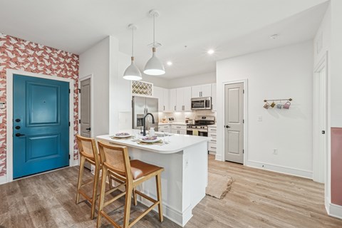 Kitchen with Quartz Countertop and Stainless Steel Appliances.
