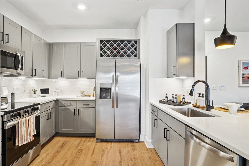 Kitchen with Quartz Countertop and Stainless Steel Appliances.