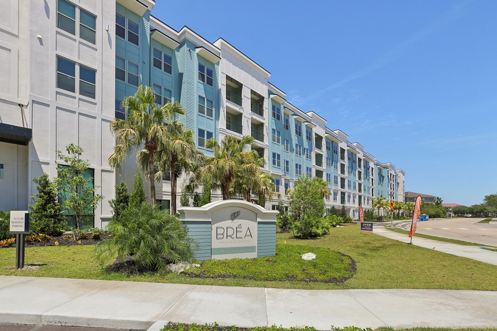 an exterior view of an apartment building with a sign that says brea in front