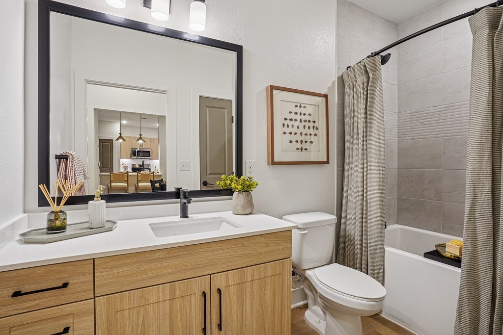 Bathroom with Quartz Countertop and Soaking Tub