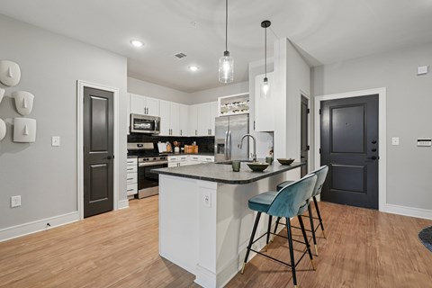 Kitchen with Granite Countertop and Stainless Steel Appliances.