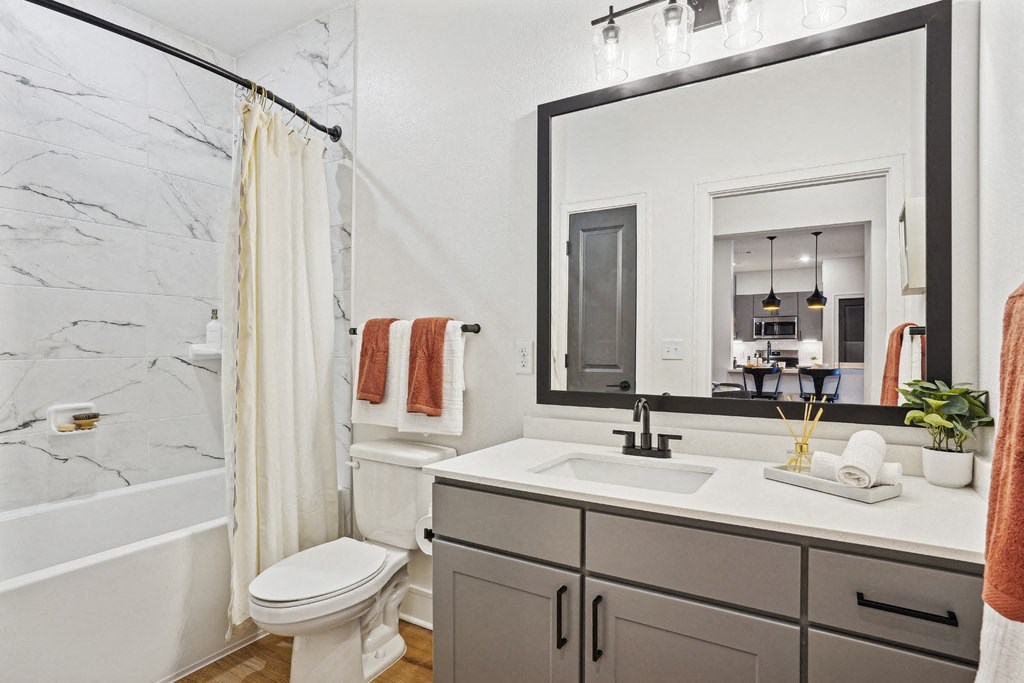 Bathroom with Quartz Countertop and Soaking Tub
