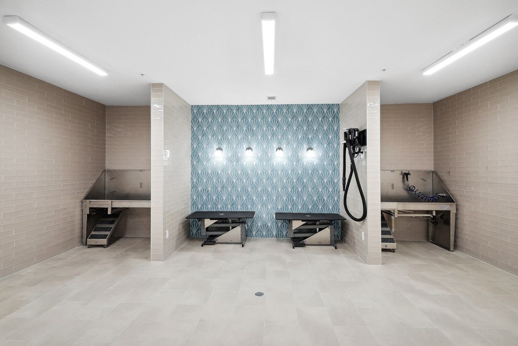 a fitness room with benches and a shower