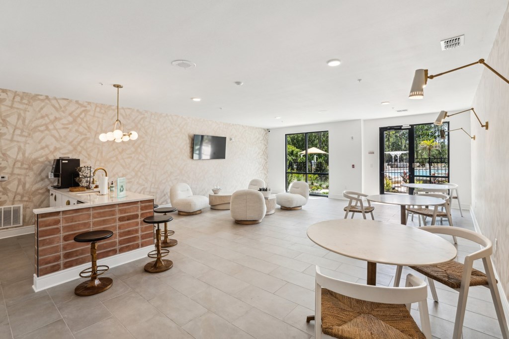 A modern open plan living and dining area with a kitchen island.