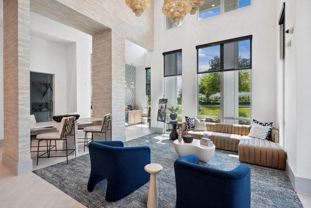 a living room with couches and chairs and a fireplace