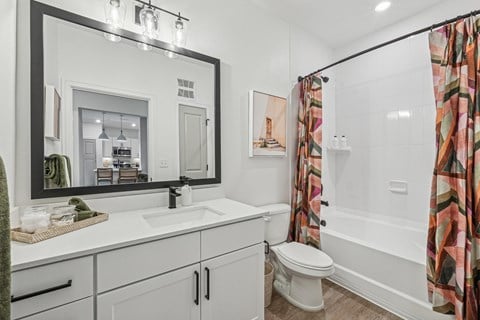Bathroom with Quartz Countertop and Soaking Tub