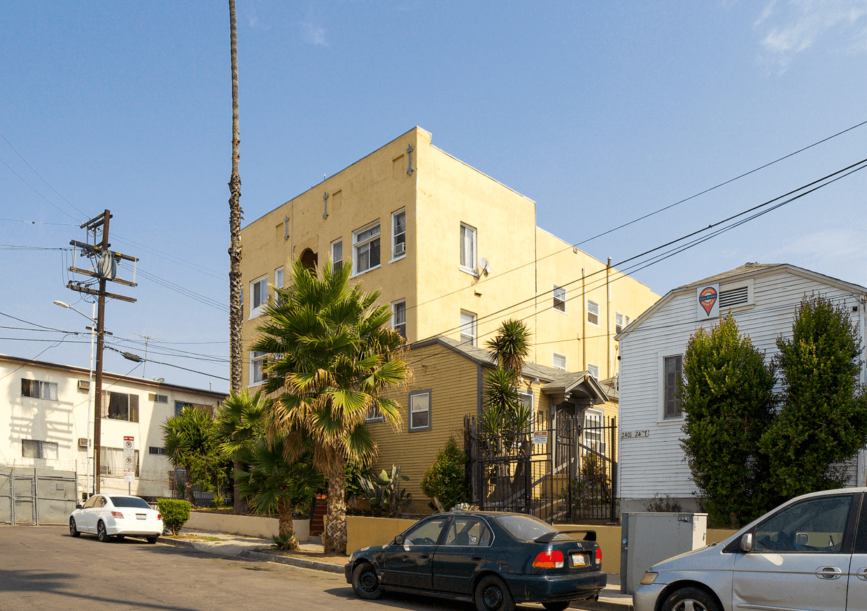 A street view with cars and buildings.