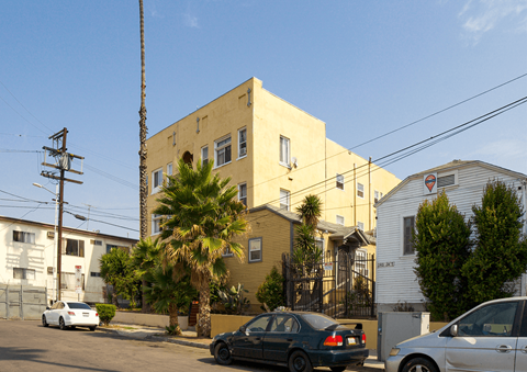 A street view with cars and buildings.