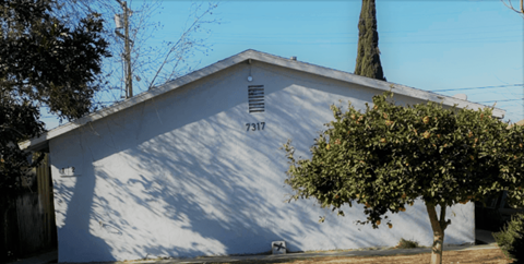A white building with the number 7313 on it.