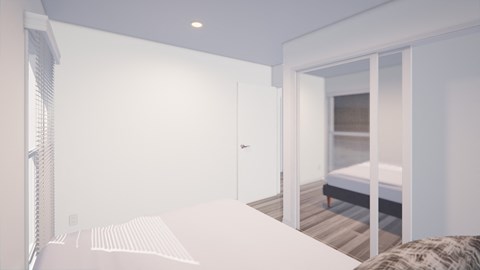 A white bedroom with a bed and a window.