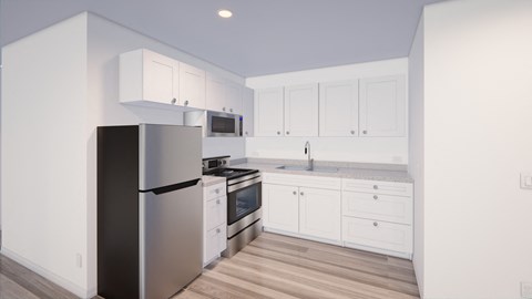 A modern kitchen with white cabinets and stainless steel appliances.