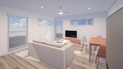 A modern living room with a large sofa, a television, and a dining table.