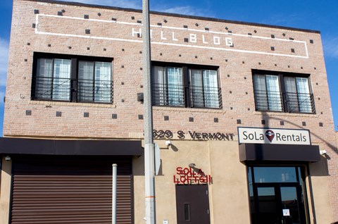 A building with a sign that says "Hell Blog" on the side.