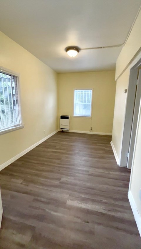 A room with a window and a door.