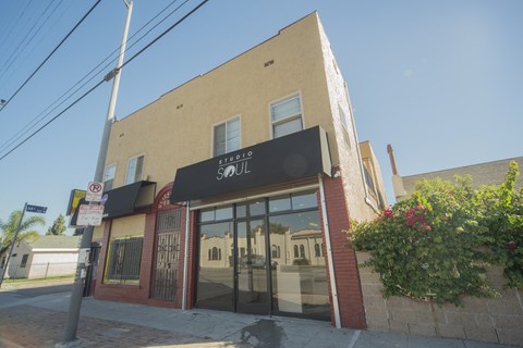 A building with a black awning that says "SOUL" on it.